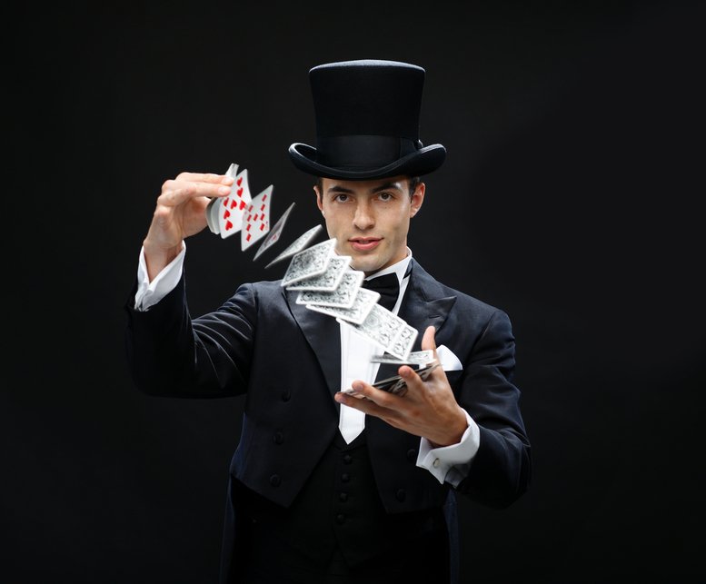 magician showing trick with playing cards